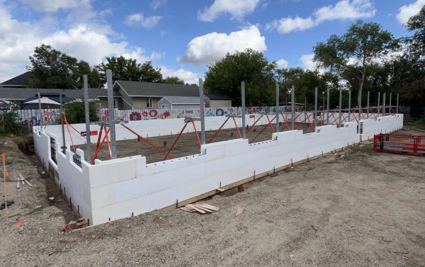 An insulated ICF grade beam perimeter stacked, braced and squared around a shop footprint, ready for the pour